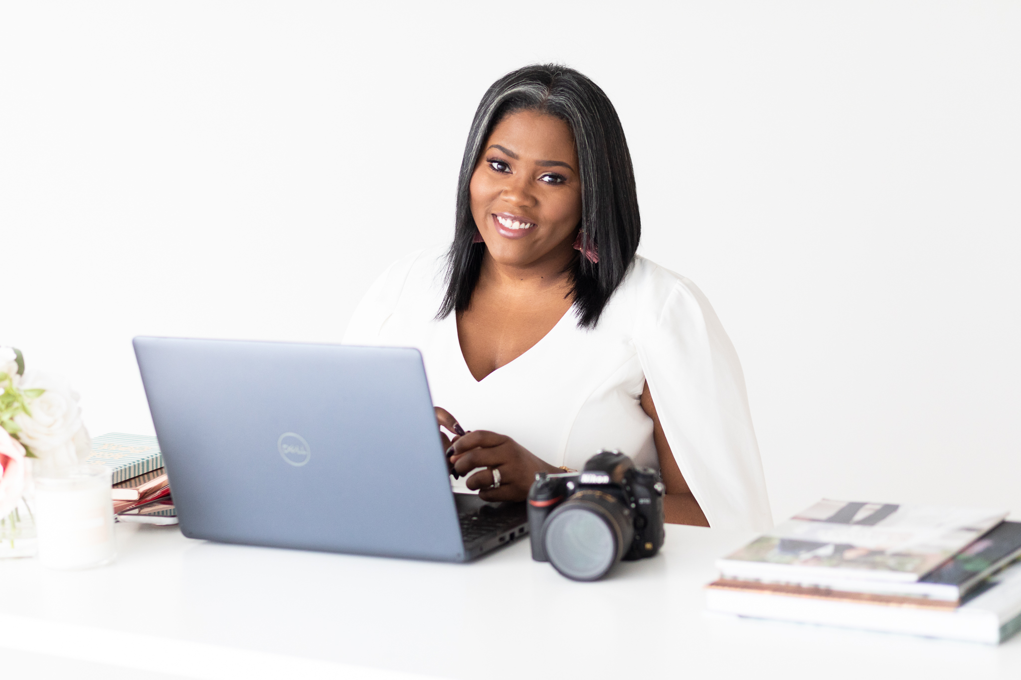 black female photographer working at desk